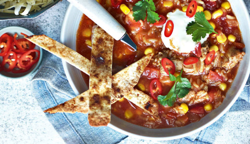 Chicken enchilada soup with crispy tortillas