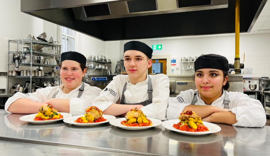 Highlands College's Saag aloo, new potatoes and oven-roast chicken thighs with a tomato & red pepper sauce